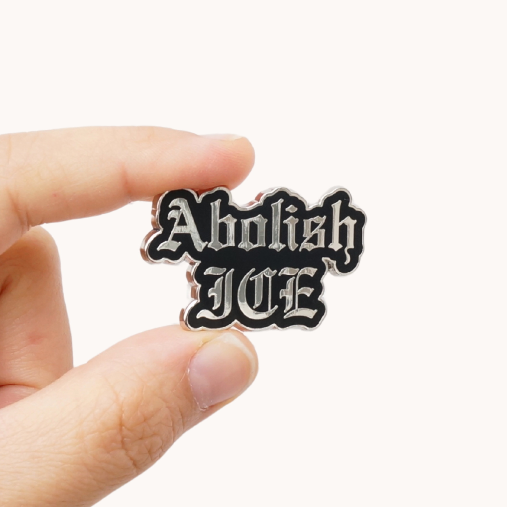 Silver and Black Abolish ICE Pin